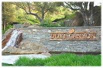 Community entrance with waterfall and logo