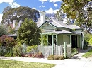 Old craftsman with white picket fence